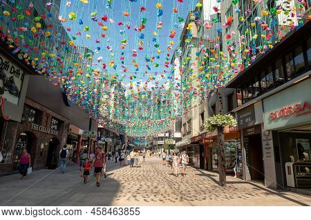 Andorra La Vella, Andorra : 2022 July 20 : People Walk In The Comercial Street Named Meritxell. Ando