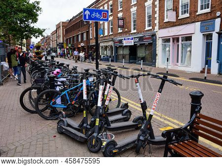 Chester, Uk; Jul 3, 2022; An Assortment Of Ginger E-scooters Adjacent To A Cycle Parking Area On Nor