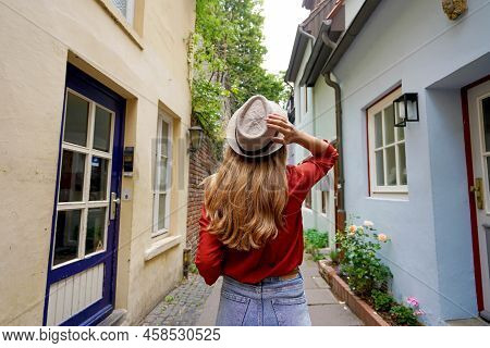 Beautiful Traveler Woman Walking In Schnoor Neighborhood, Bremen, Germany