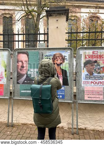 Kilstett, France - Apr 9, 2022: Rear View Of Woman Taking Photo Of 2022 French Presidential Election