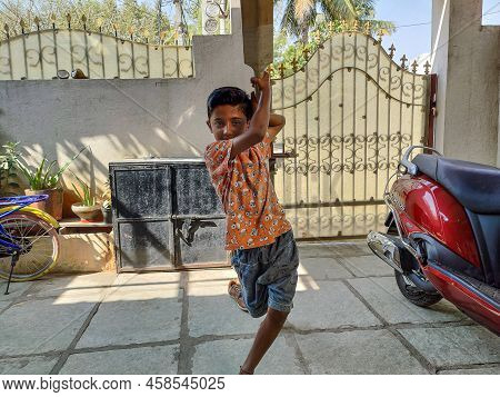 Gulbarga,india- February 15th 2021; Stock Photo Of Indian Kid Wearing Orange Color T Shirt And Short