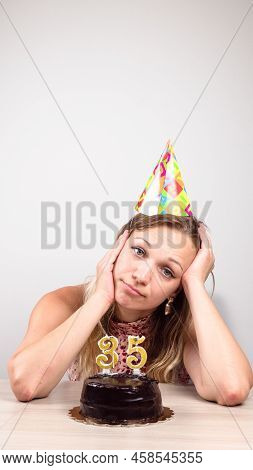 A Woman Celebrates Her Birthday Alone. Beautiful Sad Woman Clebrating Her Birthday Alone