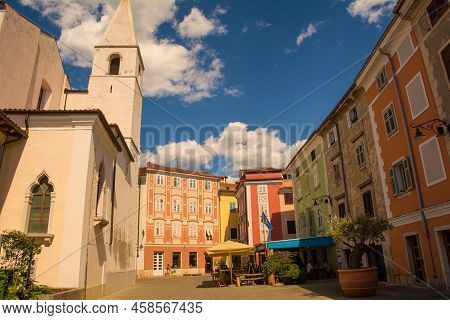 A Quiet Square In The Historic Centre Of Izola On The Coast Of Slovenia. The Church Of Saint Marije 