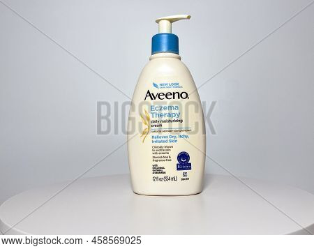 Orlando, Fl Usa - July 14, 2022:  A Bottle Of Aveeno Eczema Therapy Daily Moisturizing Cream On A Wh