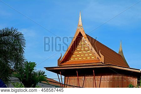 Ornate Gable Roof Of Thai Traditional Wooden House With Islamic Art Motif