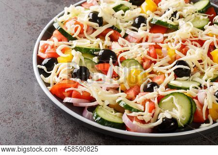 Tasty Shopska Or Sopska Salata With Vegetables And Cheese Closeup In The Plate On The Table. Horizon
