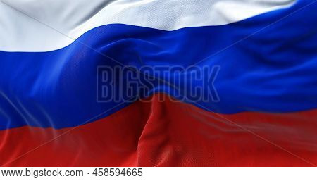 Close-up View Of The Russian National Flag Waving In The Wind. Russia Is A Transcontinental Country 