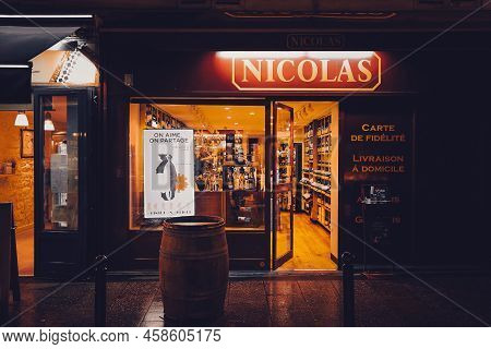 Paris, France - February 15, 2018: Entrance Of Traditional Wine Shop On Rue Cler At Night. Nicolas I
