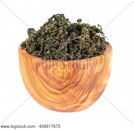 Dry Gynostemma Pentaphyllum Leaf In Olive Bowl, Isolated On White Blackground. Jiaogulan Or Miracle 
