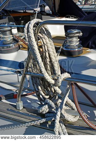 Closeup Details Of Marine Ropes, Railing And Winches On A Yacht Deck.