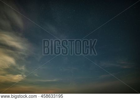 Beautiful Noctilucent Cloud Formations In Night Sky With Milky Way In The Background