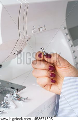 Seamstress Holds Sewing Machine Parts In Hands. Presser Foot Accessories In Tailor Hand. Dressmaker 