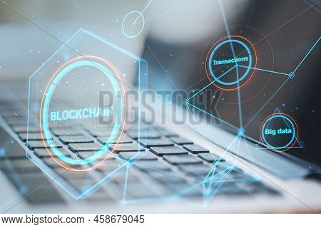 Close Up Of Laptop With Creative Polygonal Blockchain Hologram On Blurry Background. Technology And 