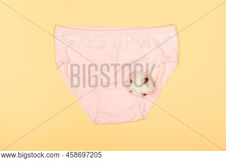 Clothes For Children In The Form Of Panties On A Yellow Background. Clothes For Children From Soft F