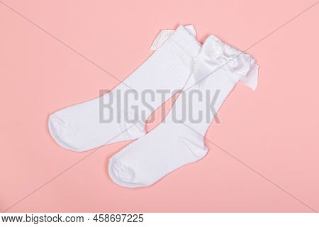 High White Children's Socks For Girls With Big Bows For Party Wear On A Pink Background