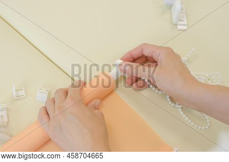 Assembly Of Roller Blinds. Women's Hands Are Assembling Roller Blinds, Close-up.