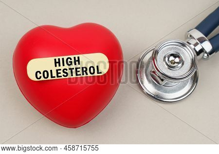 Medicine Concept. Near The Stethoscope Lies A Heart On Which A Sticker Is Pasted With The Inscriptio