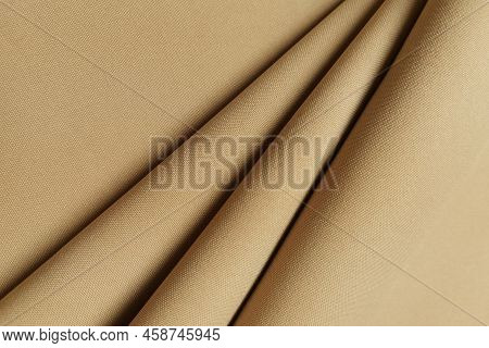 Beige Crumpled Or Wavy Fabric Texture Background. Abstract Linen Cloth Soft Waves. Gabardine Wool Fa