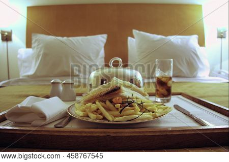 Ham And Cheese Sandwich With Fries And A Glass Of Soda In The Front With Some Pillows In The Back, I