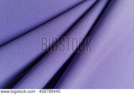 Violet Crumpled Or Wavy Fabric Texture Background. Abstract Linen Cloth Soft Waves. Gabardine Wool F