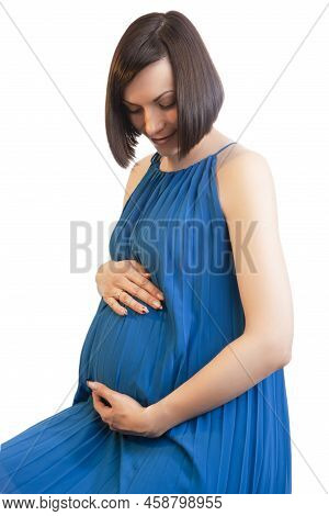 Smiling Pregnant Caucasian Brunette Woman Posing In Light Blue Dress Against Pure White Background W