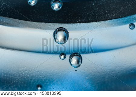 Air Bubbles From A Water Bottle On Blue Background