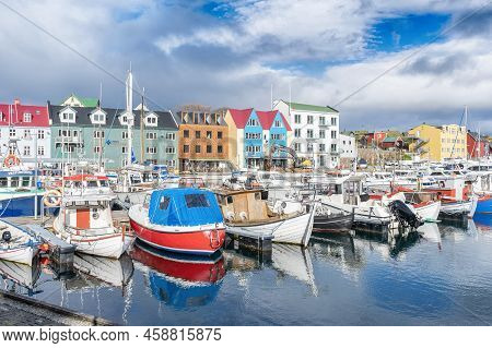 Faroe Islands. Denmark. 11 May. 2022. Boats Parked In The Bay, Among The Beautiful Small, Colorful H