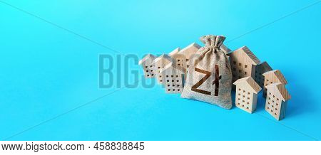 Polish Zloty Money Bag Surrounded By Houses. Mortgage Loan. Budget And Funding. Construction Industr