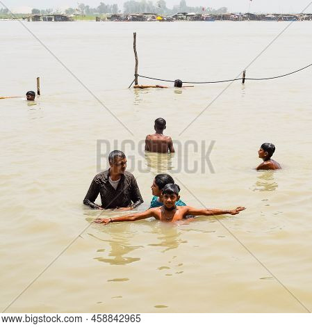 Garh Mukteshwar, Uttar Pradesh, India - June 11 2022 - People Are Taking Holy Dip On The Occasion Of