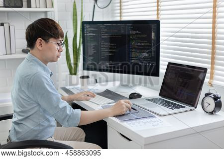 Professional development programmers are laying out a structure or draft on paper in preparation for