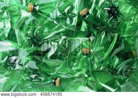 Background From Plastic Bottles. The Concept Of Pollution Of The Planet With Plastic Bottles And Pla