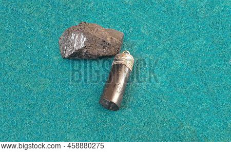 Black Tourmaline Crystal Healing Natural Mineral. Against White Background. Powerful Protection Agai