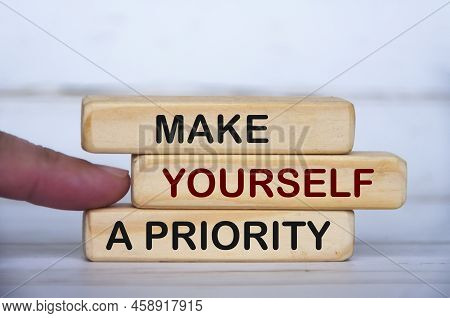 Make Yourself A Priority Text On Wooden Blocks. Inspirational And Motivational Concept