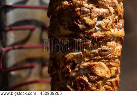Close Up Shot Of Stacked Meat Roasting