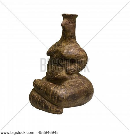 Isolated Ancient Figurine On A White Background. Figurine Of A Seated Woman From The Neolithic Perio