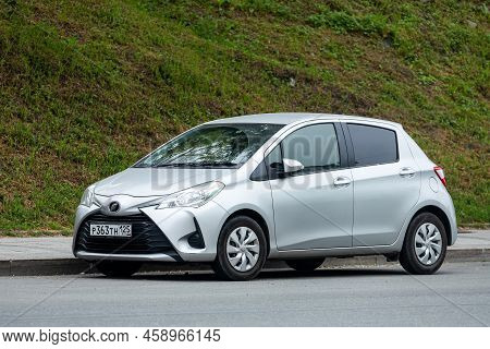 Vladivostok, Russia - July 14, 2022:    Silver  Toyota Vitz  Is Parked  On The Street On A Warm Summ