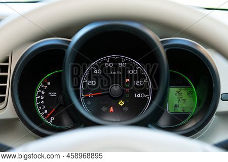 Novosibirsk, Russia -  July 29, 2022:   Honda N-box,  New Car Interior Details. Speedometer, Tachome