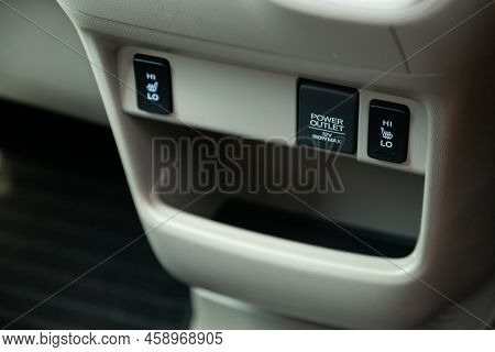 Novosibirsk, Russia -  July 29, 2022:   Honda N-box,  Close Up Of A Charging In The Car,  Seat Heatt