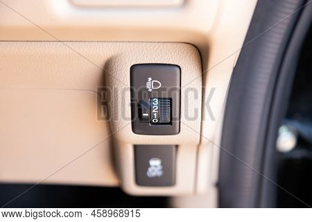Novosibirsk, Russia -  July 29, 2022:   Honda N-box, Close-up Of The  Headlight Setting Buttons. Mod