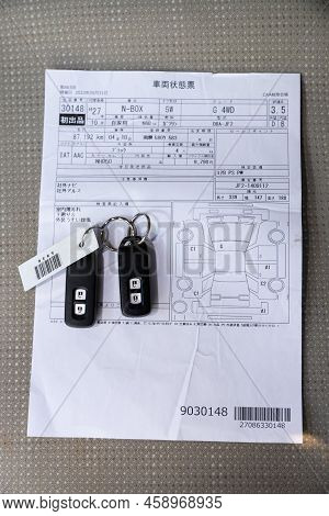 Novosibirsk, Russia -  July 29, 2022:   Honda N-box, Auction Sheet Logo Icon Sign Paper Document For