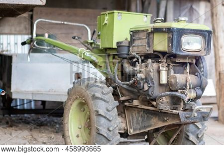Typical Heavy Diesel Walking Tractor With Trailer. Agricultural Transport Equipment Of The Countrysi