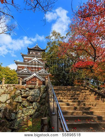 Hiroshima castle on the side of Otagawa river in autumn