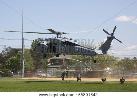 MH-60S helicopters from Helicopter Sea Combat Squadron Five with US Navy EOD team landing