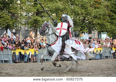 Riga, Latvia - August 21: Member Of The Devils Horsemen Stunt Team Riding White Horse During Riga Fe