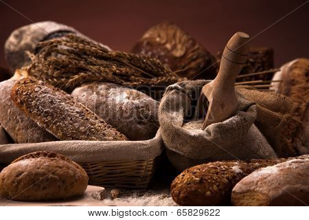 Fresh Bread And Wheat On The Wooden Table