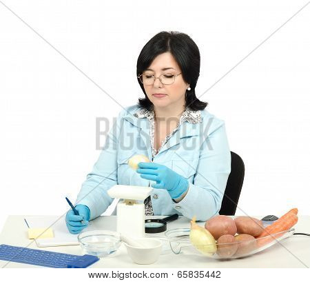 Expert Weighing A Onion In Laboratory
