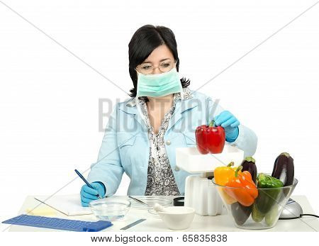 Expert Weighing A Red Bell Pepper In Laboratory