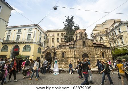 ATHENS, GREECE - MAY 10, 2014: Church of Panagia Kapnikarea in center of city. Tourism is a decisive sector of hope for Greek economy - In the year Greece receives about 18 million tourists.