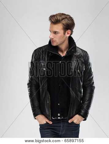 Fashion man, model leather jacket, gray background