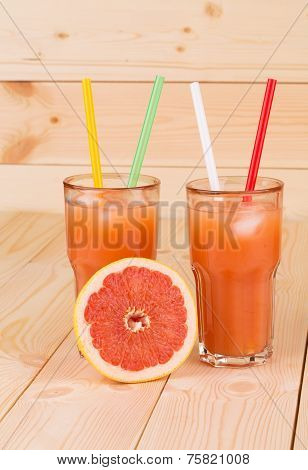 Grapefruit juice on table.